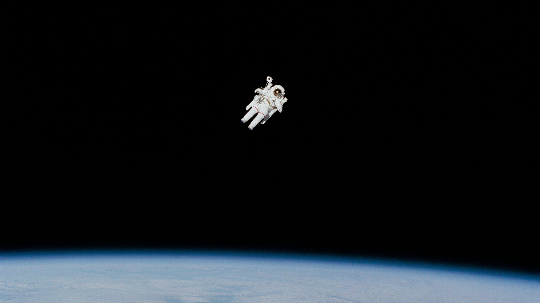 Photo of people sharing a flower