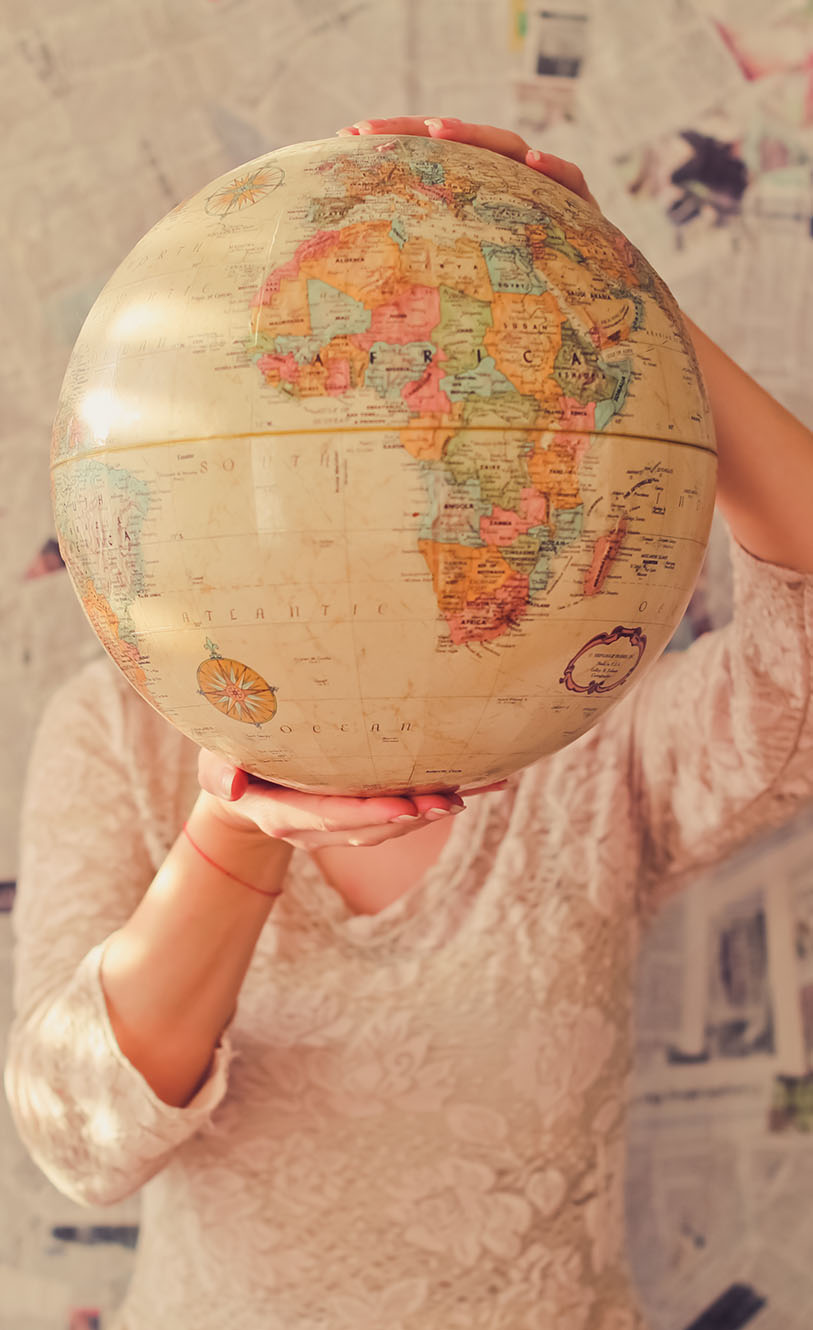 Woman holding a globe