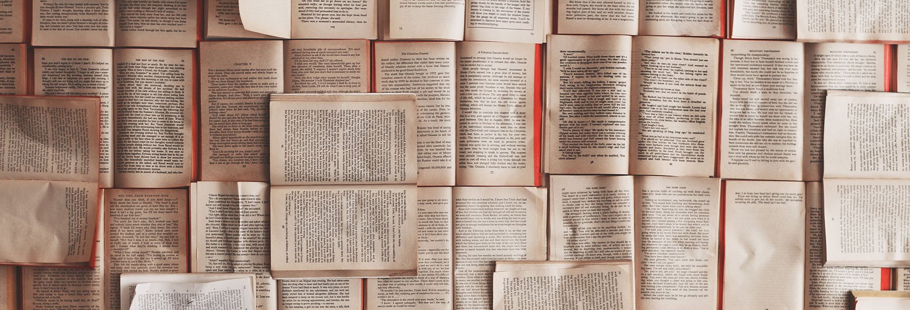 Photo of open books all over desk